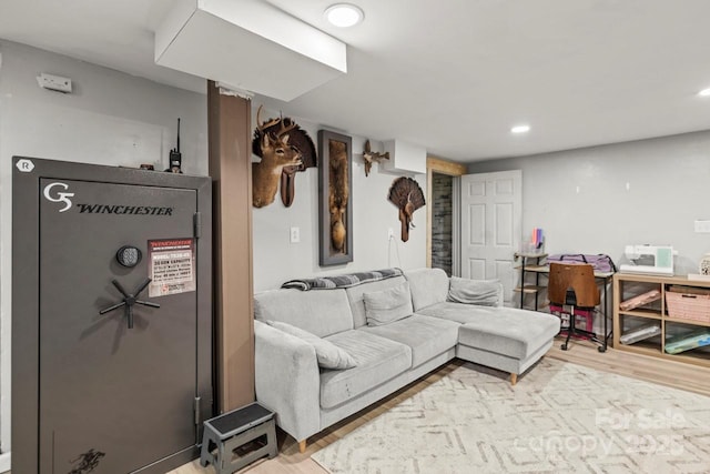 living room with light wood-style flooring and recessed lighting