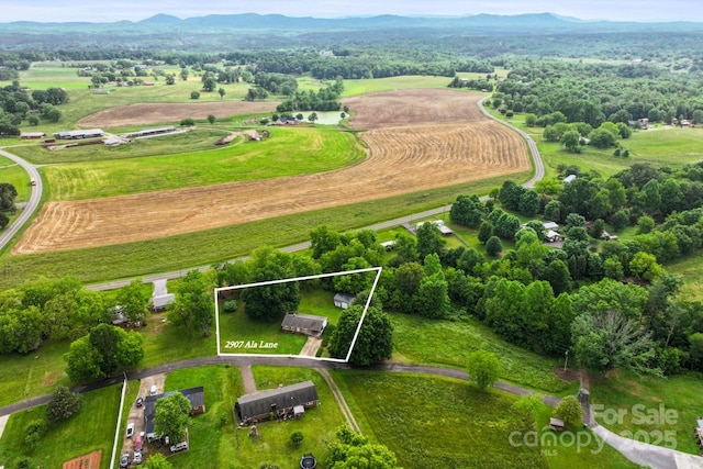 view of rural area with property boundaries highlighted and a mountain backdrop