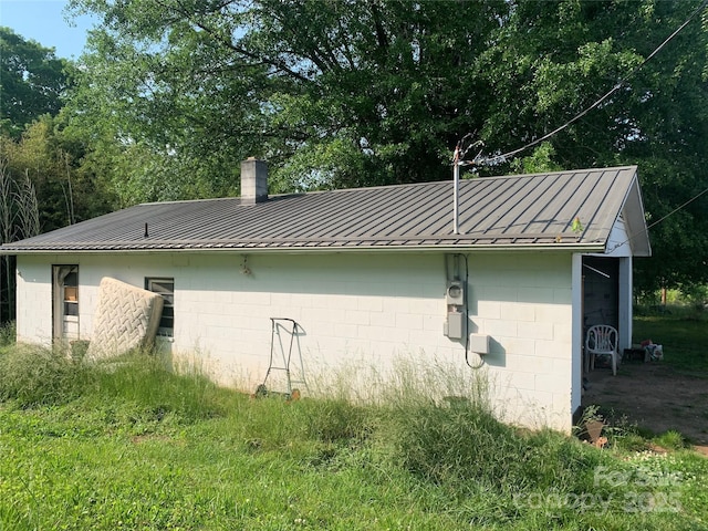 24 Pearl St Unit 8A & 8B, Granite Falls, NC 28630 - view of property exterior featuring metal roof and a standing seam roof