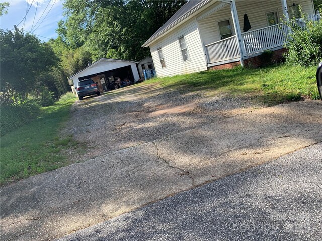 24 Pearl St Unit 8A & 8B, Granite Falls, NC 28630 - view of side of home featuring concrete driveway, a porch, and a carport