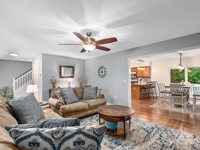 26 Morrow Dr, Fairview, NC 28730 - living area featuring light wood-style flooring, stairs, and ceiling fan