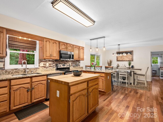 26 Morrow Dr, Fairview, NC 28730 - kitchen with appliances with stainless steel finishes, a center island, butcher block counters, backsplash, and dark wood finished floors