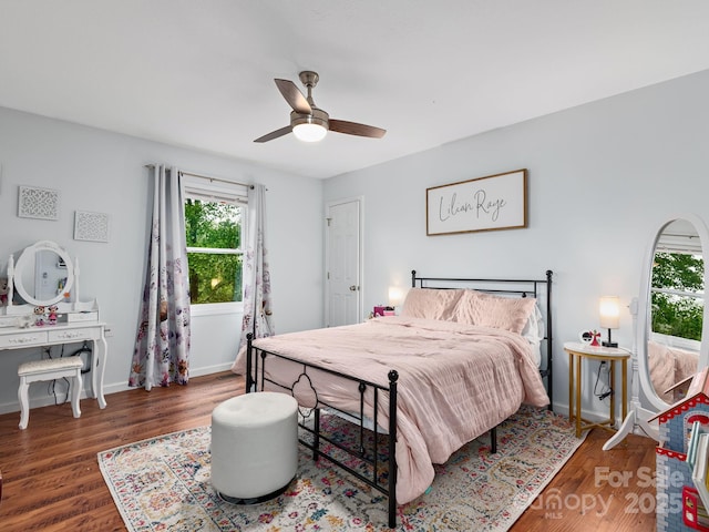 26 Morrow Dr, Fairview, NC 28730 - bedroom featuring multiple windows, wood finished floors, and ceiling fan