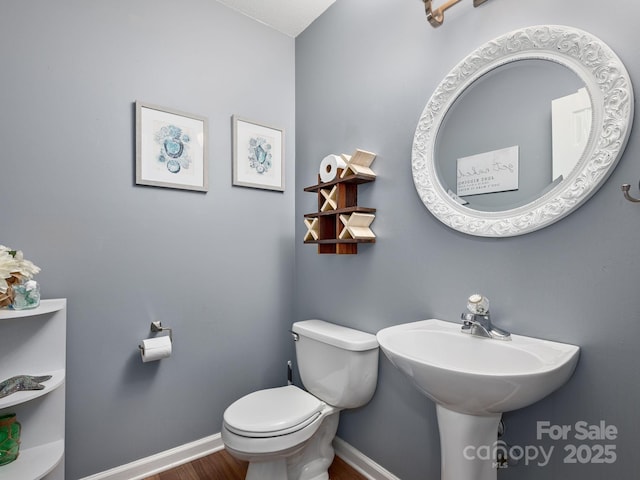 26 Morrow Dr, Fairview, NC 28730 - half bathroom featuring toilet and wood finished floors