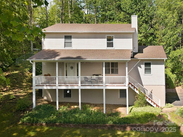 26 Morrow Dr, Fairview, NC 28730 - view of front of home with a chimney, a shingled roof, a porch, and stairs
