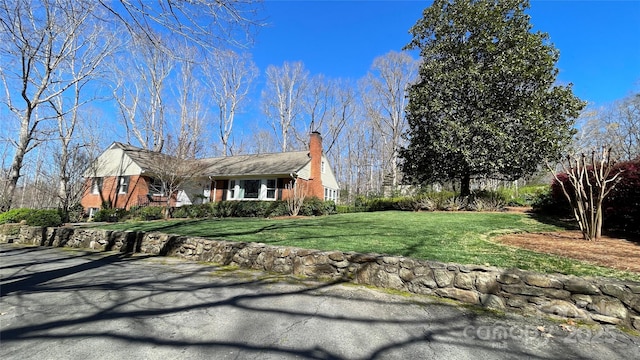 700 Valleyview Dr Unit 1, Albemarle, NC 28001 - view of front of house with brick siding, a chimney, and a front lawn