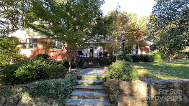 700 Valleyview Dr Unit 1, Albemarle, NC 28001 - view of property hidden behind natural elements featuring brick siding and a front yard