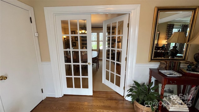 700 Valleyview Dr Unit 1, Albemarle, NC 28001 - doorway featuring a wainscoted wall, french doors, dark wood-style floors, a chandelier, and a decorative wall
