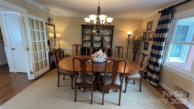 700 Valleyview Dr Unit 1, Albemarle, NC 28001 - dining area featuring a chandelier, wood finished floors, and crown molding