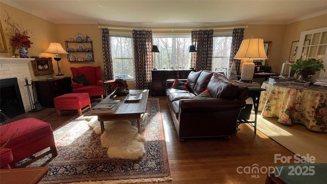 700 Valleyview Dr Unit 1, Albemarle, NC 28001 - living area featuring healthy amount of natural light, wood finished floors, crown molding, and a brick fireplace