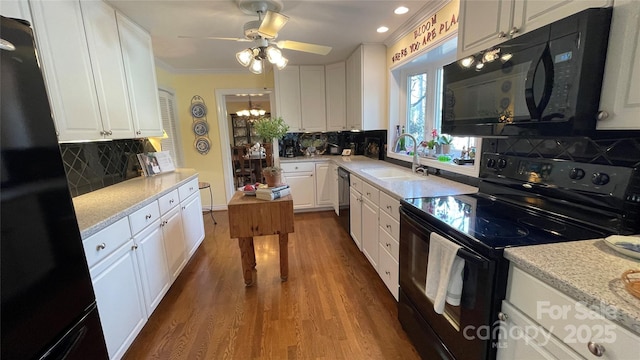 700 Valleyview Dr Unit 1, Albemarle, NC 28001 - kitchen with black appliances, a sink, ornamental molding, white cabinetry, and backsplash
