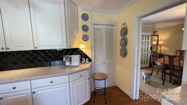 700 Valleyview Dr Unit 1, Albemarle, NC 28001 - kitchen featuring white cabinetry, crown molding, decorative backsplash, dark wood finished floors, and baseboards