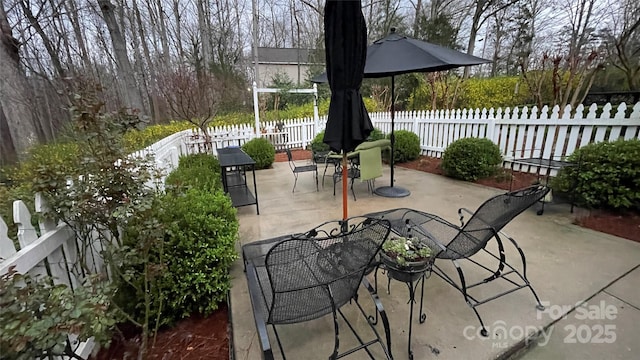 700 Valleyview Dr Unit 1, Albemarle, NC 28001 - view of patio featuring outdoor dining area and fence