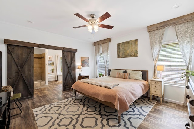 281 Crooked Creek Est, Old Fort, NC 28762 - bedroom with crown molding, wood finished floors, baseboards, a ceiling fan, and a barn door