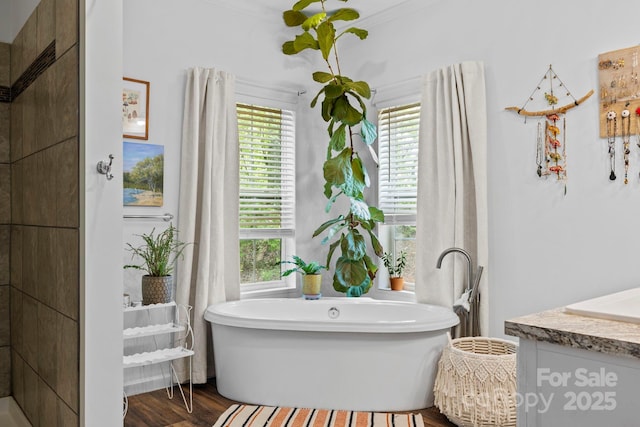 281 Crooked Creek Est, Old Fort, NC 28762 - bathroom with vanity, a freestanding tub, and wood finished floors