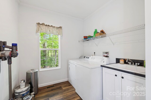 281 Crooked Creek Est, Old Fort, NC 28762 - laundry room featuring washer and dryer, plenty of natural light, crown molding, dark wood-style floors, and cabinet space