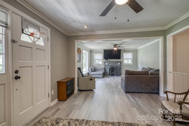 3803 Cook Rd, Valdese, NC 28690 - entryway with a ceiling fan, crown molding, wood finished floors, a fireplace with raised hearth, and wooden ceiling