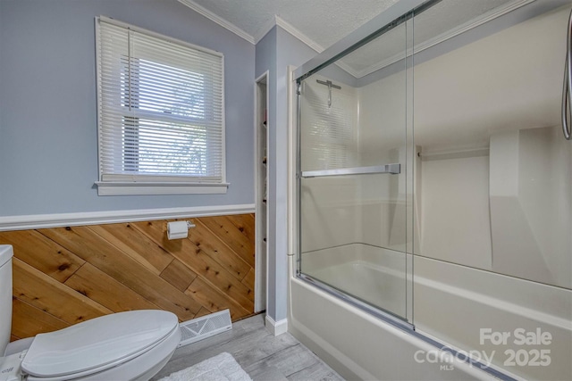 3803 Cook Rd, Valdese, NC 28690 - bathroom featuring shower / bath combination with glass door, wood finished floors, crown molding, and wooden walls
