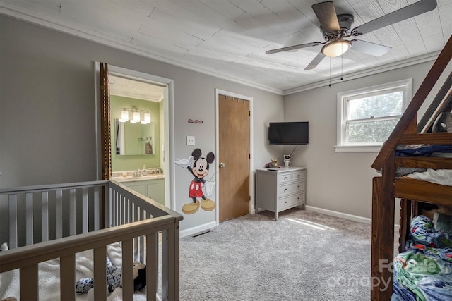 3803 Cook Rd, Valdese, NC 28690 - bedroom with light colored carpet, crown molding, a ceiling fan, a crib, and connected bathroom
