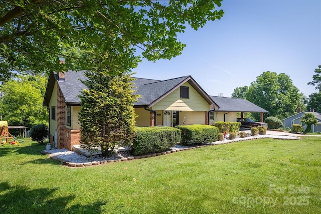 3803 Cook Rd, Valdese, NC 28690 - view of front of property featuring brick siding, a chimney, a front yard, roof with shingles, and a playground