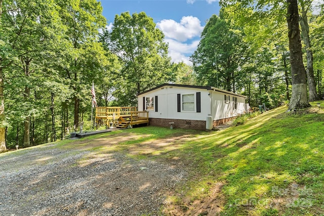2496 Messer St, Valdese, NC 28690 - view of side of property with a deck, a yard, and crawl space