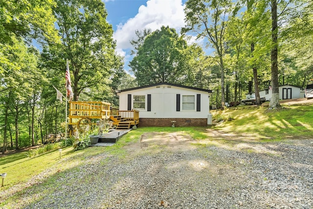2496 Messer St, Valdese, NC 28690 - view of front of property featuring crawl space, a wooden deck, and view of scattered trees