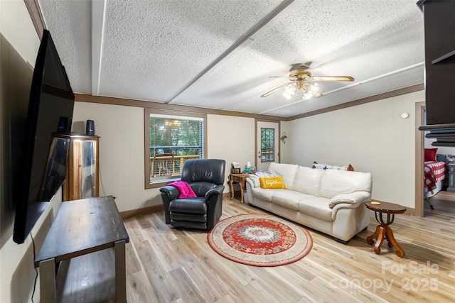 2496 Messer St, Valdese, NC 28690 - living room featuring a textured ceiling, a ceiling fan, and wood finished floors