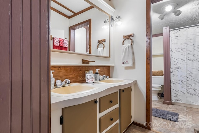 2496 Messer St, Valdese, NC 28690 - full bathroom featuring toilet, double vanity, and a textured ceiling