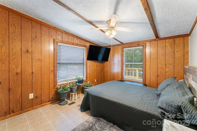 2496 Messer St, Valdese, NC 28690 - tiled bedroom with wood walls, a textured ceiling, and a ceiling fan