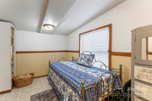2496 Messer St, Valdese, NC 28690 - bedroom with wainscoting and wooden walls