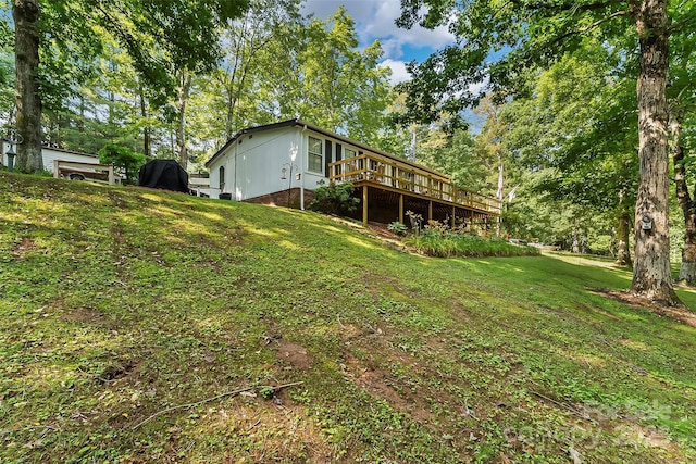 2496 Messer St, Valdese, NC 28690 - view of green lawn with a wooden deck