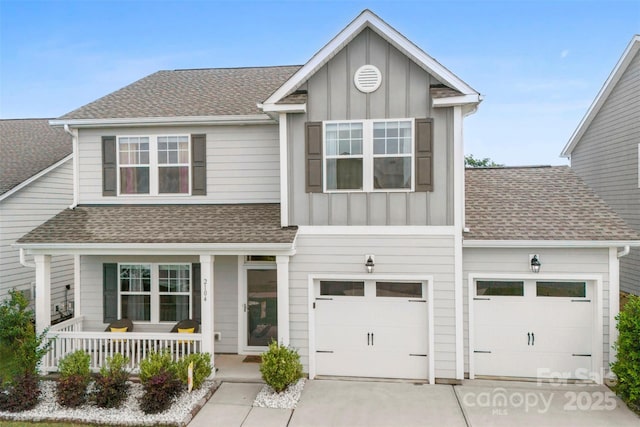 2104 New Hope Branch Way, Belmont, NC 28012 - view of front facade with board and batten siding, concrete driveway, covered porch, a shingled roof, and a garage