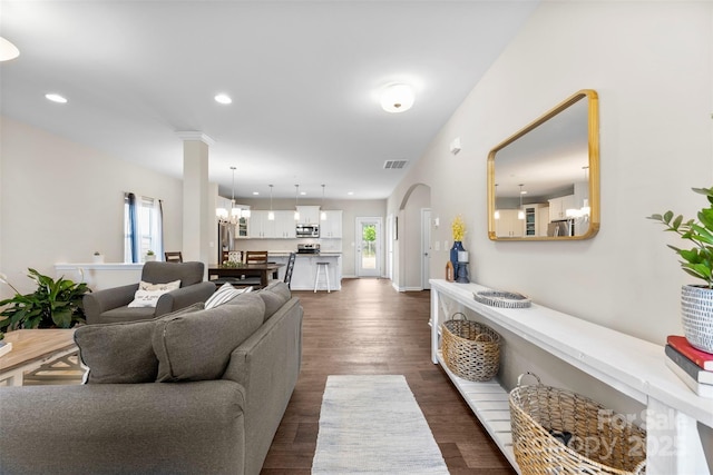 2104 New Hope Branch Way, Belmont, NC 28012 - living area featuring dark wood-style floors, recessed lighting, arched walkways, and baseboards