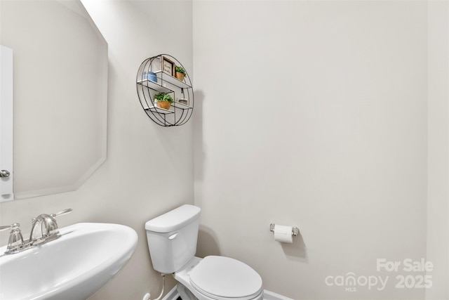 2104 New Hope Branch Way, Belmont, NC 28012 - half bath featuring a sink, toilet, and baseboards