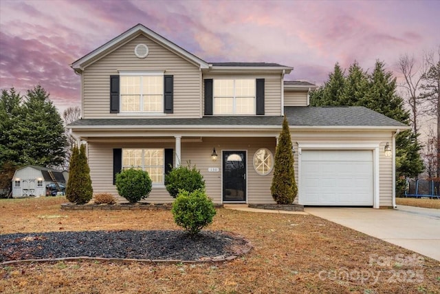 130 Valley Glen Dr, Troutman, NC 28166 - traditional-style house with driveway, a garage, and covered porch