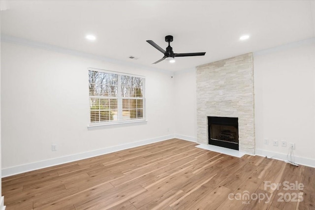 130 Valley Glen Dr, Troutman, NC 28166 - unfurnished living room featuring a fireplace, ceiling fan, wood finished floors, baseboards, and recessed lighting