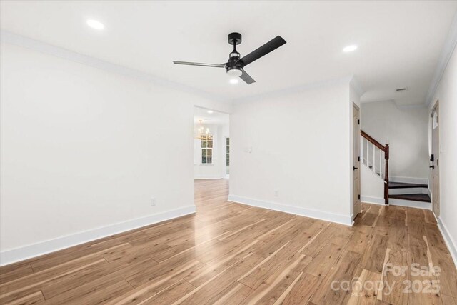 130 Valley Glen Dr, Troutman, NC 28166 - spare room with a ceiling fan, stairs, light wood-style flooring, baseboards, and recessed lighting