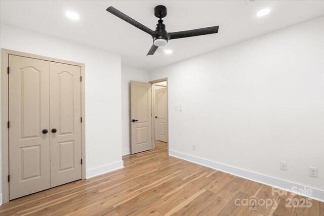 130 Valley Glen Dr, Troutman, NC 28166 - unfurnished bedroom featuring light wood finished floors, baseboards, a closet, recessed lighting, and ceiling fan