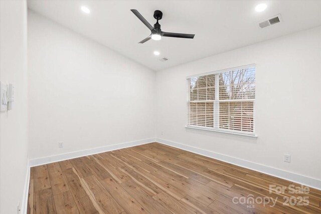 130 Valley Glen Dr, Troutman, NC 28166 - spare room with a ceiling fan, baseboards, hardwood / wood-style flooring, and recessed lighting