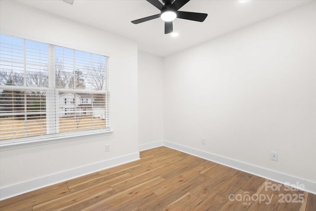 130 Valley Glen Dr, Troutman, NC 28166 - spare room featuring wood finished floors, baseboards, a ceiling fan, and recessed lighting