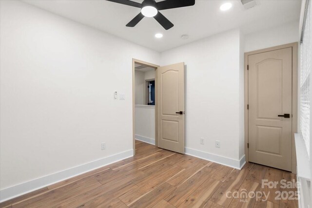 130 Valley Glen Dr, Troutman, NC 28166 - unfurnished bedroom with wood finished floors, baseboards, recessed lighting, and a ceiling fan