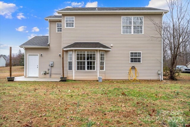 130 Valley Glen Dr, Troutman, NC 28166 - back of property with a patio area and a lawn