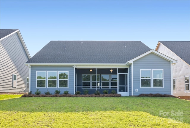 219 Tillery Ln Unit 755, Mount Gilead, NC 27306 - back of property featuring a lawn, a sunroom, and a shingled roof