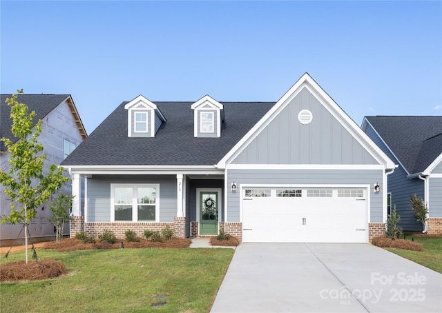 219 Tillery Ln Unit 755, Mount Gilead, NC 27306 - craftsman house featuring brick siding, driveway, a garage, a front yard, and board and batten siding