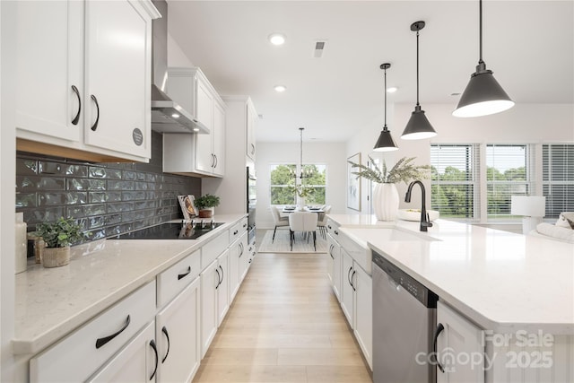 219 Tillery Ln Unit 755, Mount Gilead, NC 27306 - kitchen with appliances with stainless steel finishes, a sink, decorative backsplash, an island with sink, and white cabinets