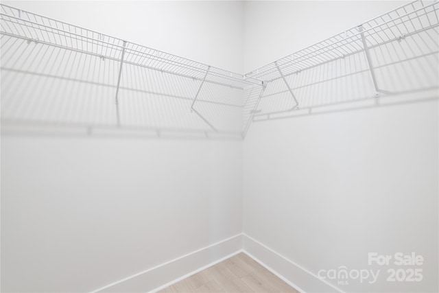 219 Tillery Ln Unit 755, Mount Gilead, NC 27306 - walk in closet featuring wood finished floors