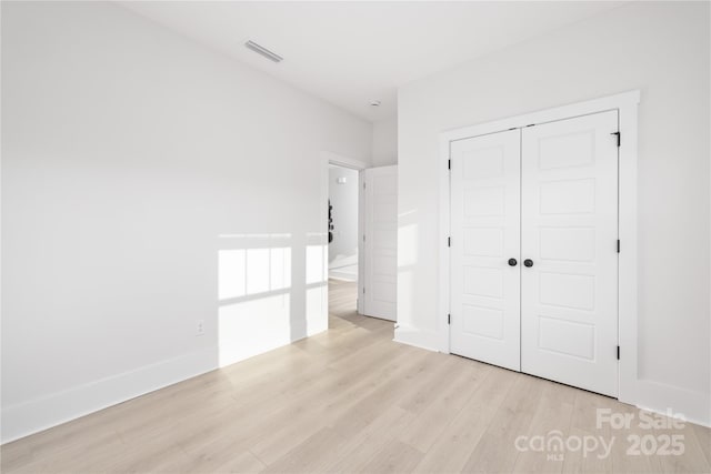 219 Tillery Ln Unit 755, Mount Gilead, NC 27306 - unfurnished bedroom with light wood finished floors, a closet, and baseboards