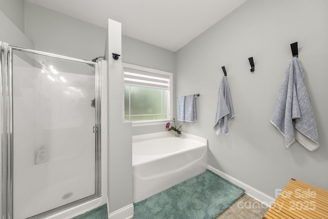 516 King St, Waxhaw, NC 28173 - full bathroom featuring a stall shower and baseboards
