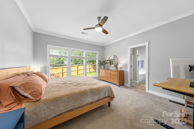516 King St, Waxhaw, NC 28173 - bedroom with ornamental molding, light colored carpet, baseboards, ceiling fan, and ensuite bathroom