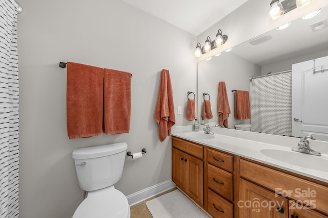 516 King St, Waxhaw, NC 28173 - full bath with toilet, double vanity, baseboards, and a shower with shower curtain